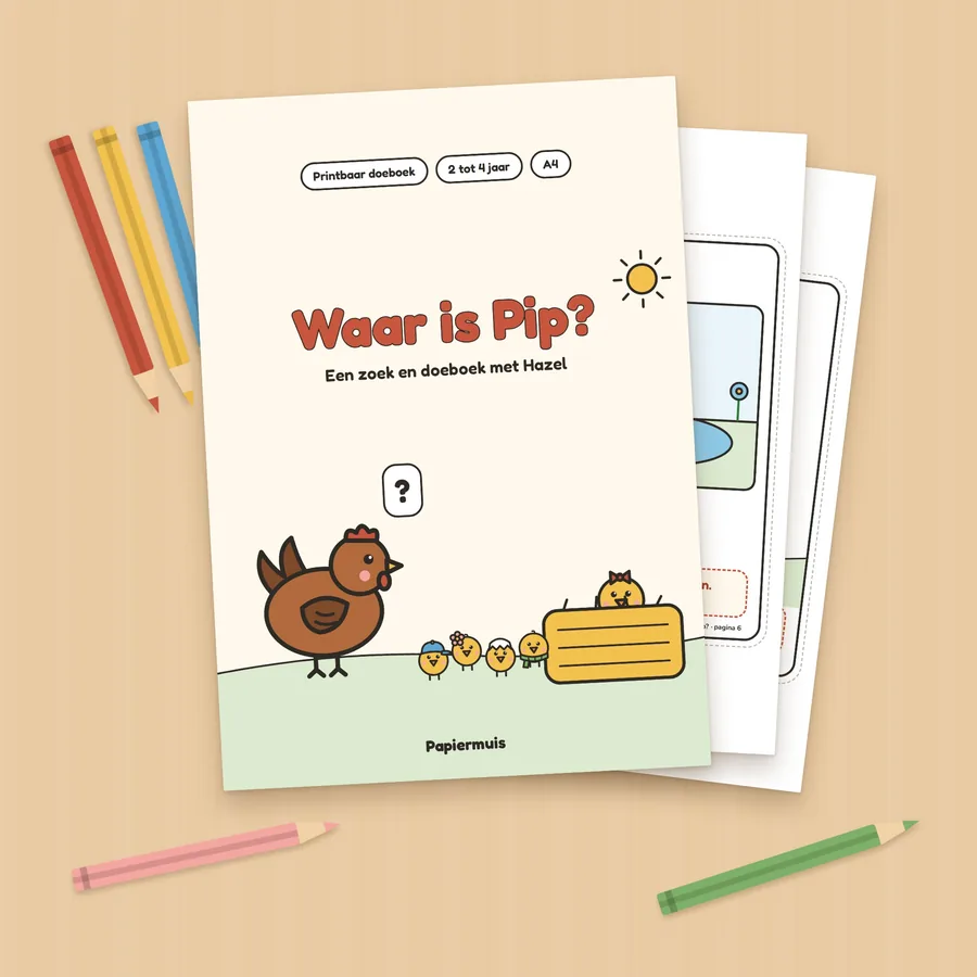 Het doeboek Waar is Pip? geprint, op een houten tafel met kleurpotloden